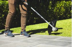 edging with a Toro 60V MAX battery string grass trimmer